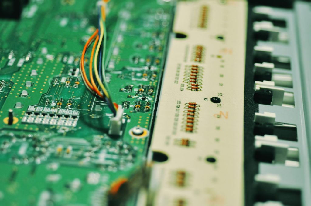 a close up of a circuit board with wires