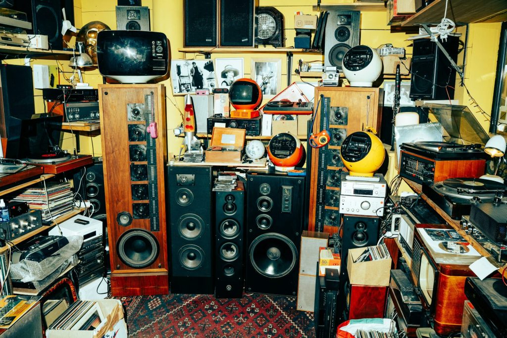 A room filled with vintage audio equipment and speakers.