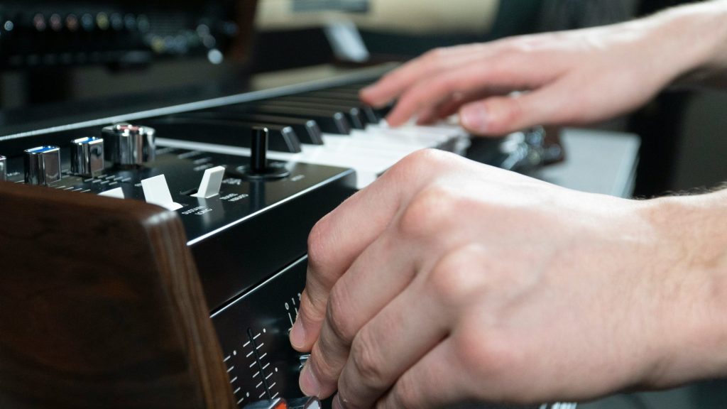 a person is playing a musical instrument in a recording studio